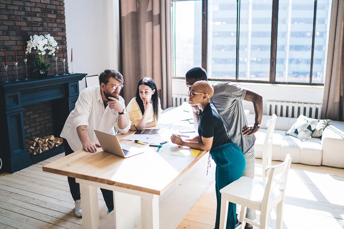 Diverse startup team collaborating in modern tech office