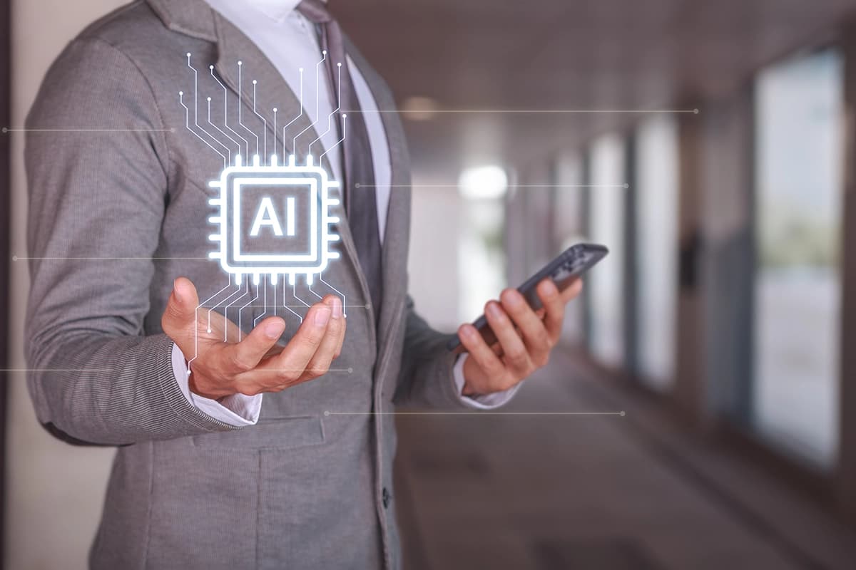 Businessman holding smartphone with AI technology