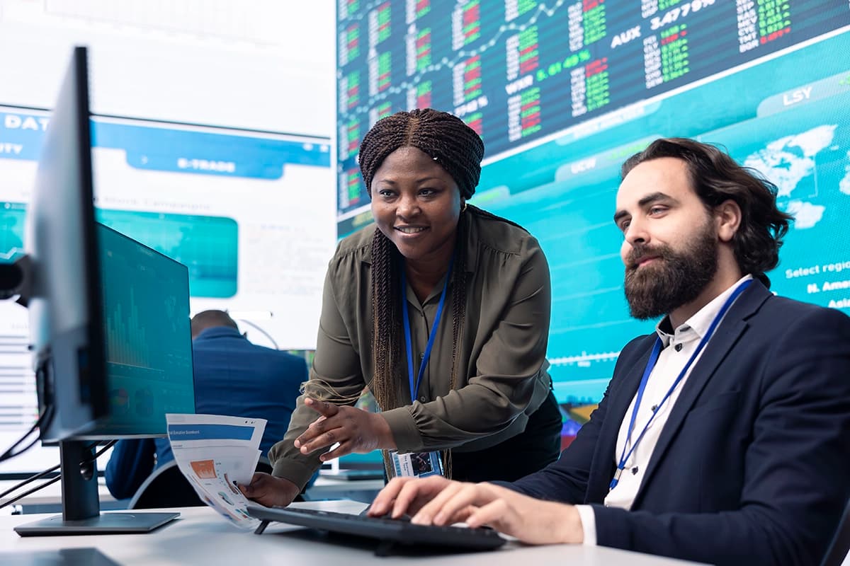 Team of diverse specialists reviewing stocks