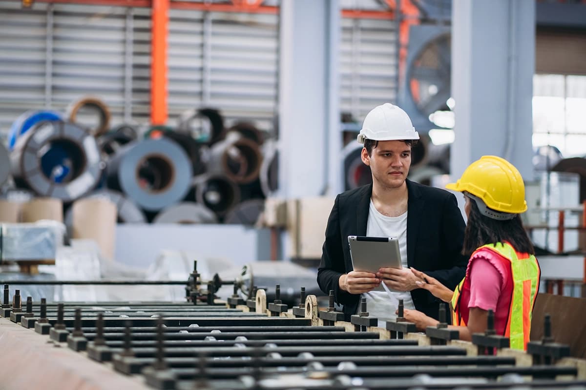 Technician working in the metal sheet company