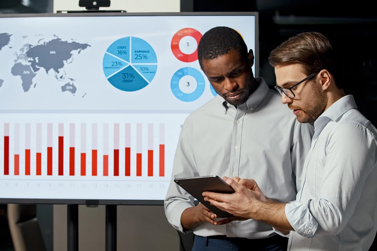 Two businessmen discussing AI strategies